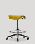 Yellow Humanscale Saddle stool with a saddle seat on a white background. Kansas City Office Design.