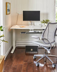 Modern home office with a desk, chair, and Humanscale footrest. Kansas City Office Design.