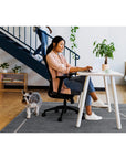 SitOnIt Novo Desk Chair in Black Mesh with Black Fabric. Women sitting in chair working – Adjustable Ergonomic Chair by Kansas City Office Design