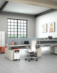 Modern office space with a power bench sit to stand desk, chairs, and decor. Kansas City Office Design.