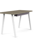 Back view of the SitOnIt Reya Office Desk with Angled Metal Legs. The legs are white with a Sandalwood top. Kansas City Office Furniture
