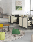 Friant Roke Coffee Table with raised edge and metal frame in open office lounge area. Kansas City office furniture
