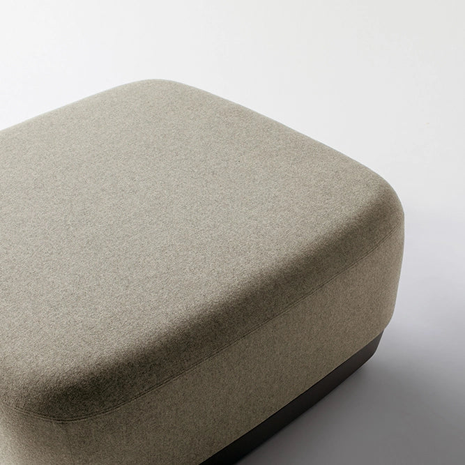 Beige Pasea ottoman on a white background. Kansas City Office Design.