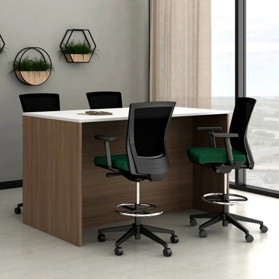 Modern office setup with a desk and chairs in a bright room. Kansas City Office Design.