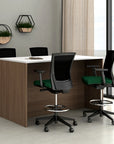 Modern office setup with a desk and chairs in a bright room. Kansas City Office Design.