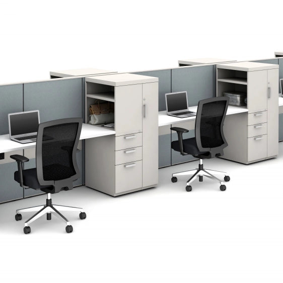 Modern office cubicles with desks, chairs, and computer monitors on a white background. Kansas City Office Design