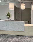 Modern reception desk with marble top in an office setting. Kansas City Office Design.