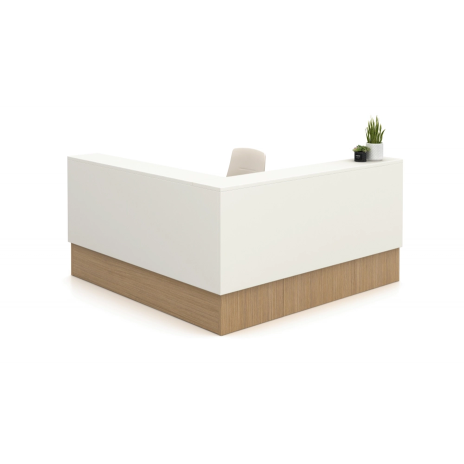 White reception desk with wooden base on a white background. Kansas City Office Design