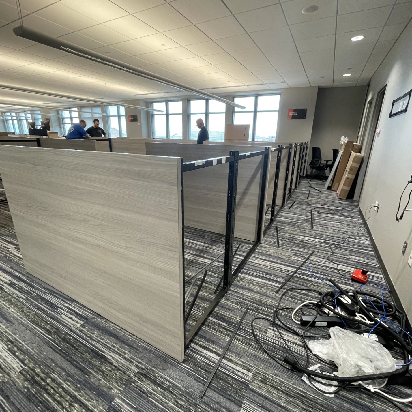 Workstation install. This includes laminate tiles, power, storage, height adjustable desk. AIS Matrix furniture. Kansas City Office Design.