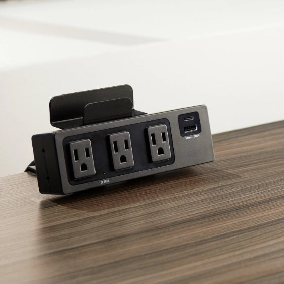SitonIt Current Power strip with multiple outlets and USB ports on a wooden surface. Kansas City Office Design.