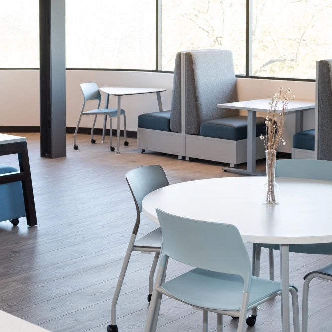 Modern office or meeting area with tables and chairs. Kansas City Office Design