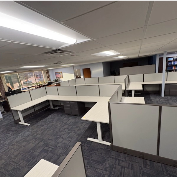Modern office with gray carpet and white office cubicles. Kansas City Office Design