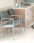 Two chairs with light blue seats and gray backs in a room with a desk and cabinets. Kansas City Office Design.