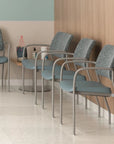 Row of chairs in a waiting room with a wooden wall and light-colored floor. Kansas City Office Design.