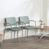 Two green SitOnIt Cora guest chairs with metal frames in a waiting room setting. Kansas City Office Design.