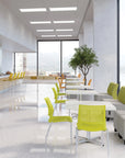 Modern office cafeteria with tables, chairs, and large windows. Kansas City Office Design.