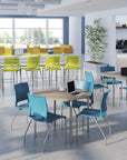 Modern office space with colorful chairs and tables. Kansas City Office Design.