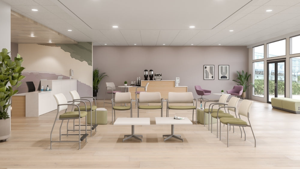 Modern office waiting area with chairs, tables, and large windows. Kansas City Office Design.