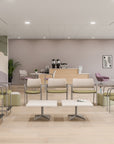 Modern office waiting area with chairs, tables, and large windows. Kansas City Office Design.