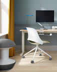 Modern home office with a desk, trea chair, and gray Humanscale Ballo Stool. Kansas City Office Design.