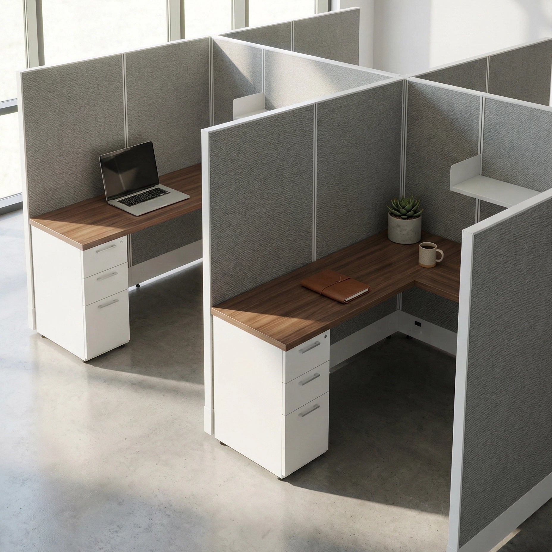 Modern office cubicles with wooden desks and gray partitions. Kansas City Office Design
