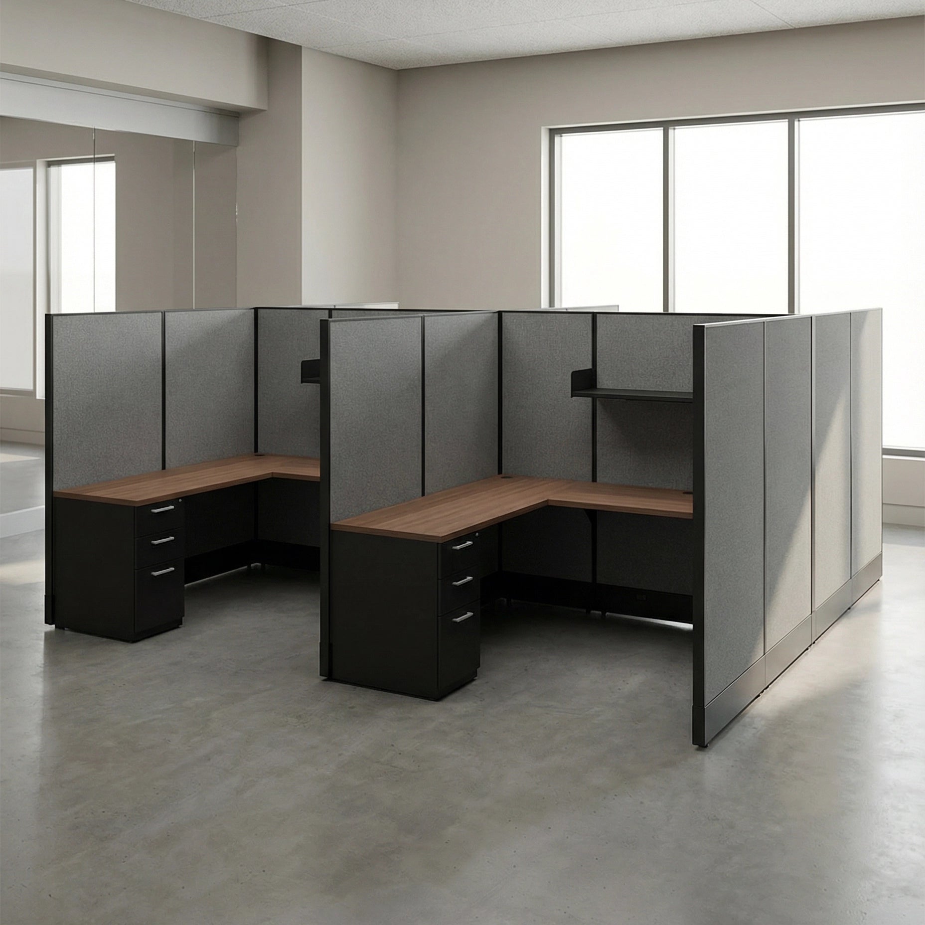 Modern office cubicle setup with gray walls and wooden desks in a bright room. Kansas City Office Design