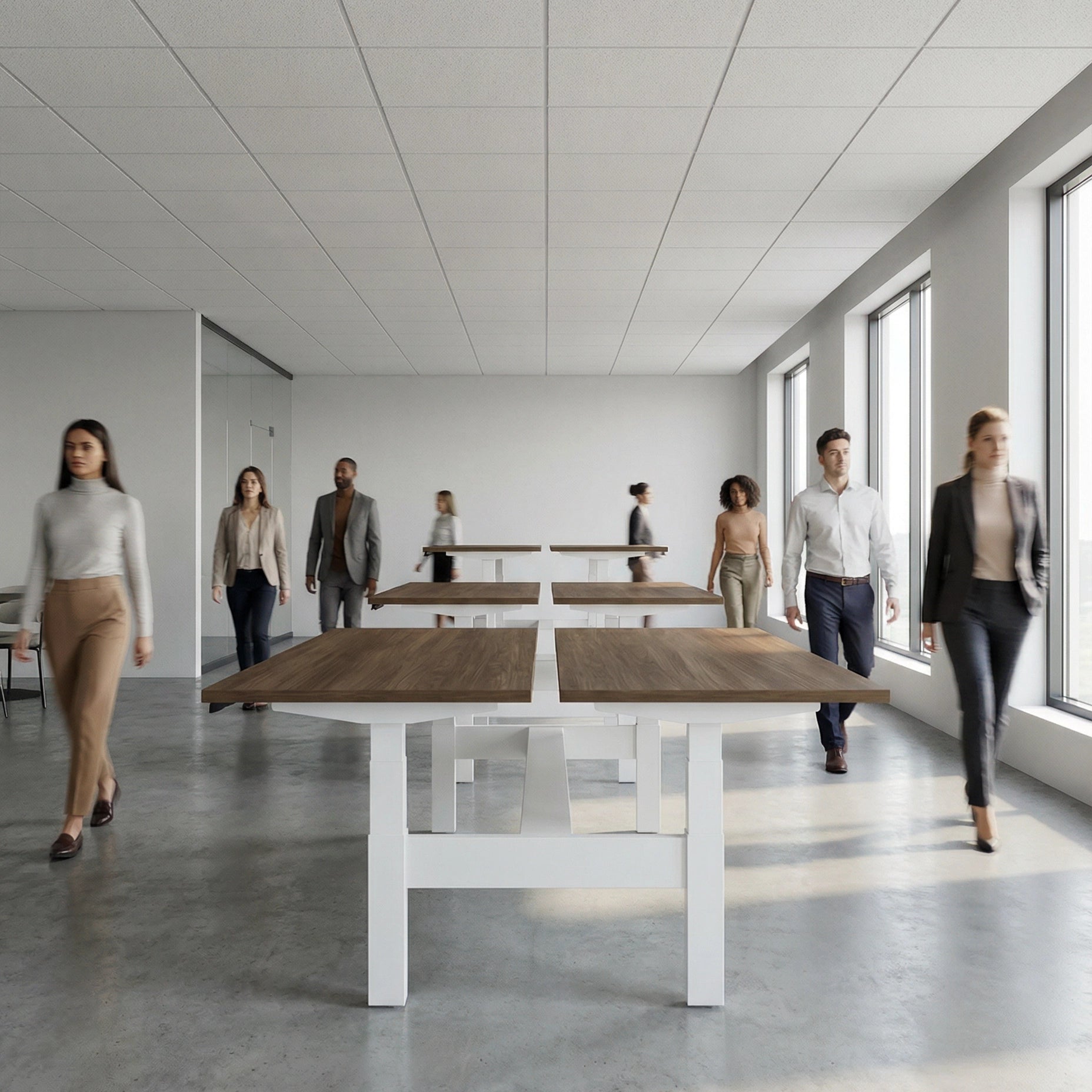 HAT Collective Height adjustable 4pod with white base and walnut Tops with people working in an open office. Kansas City Office Design