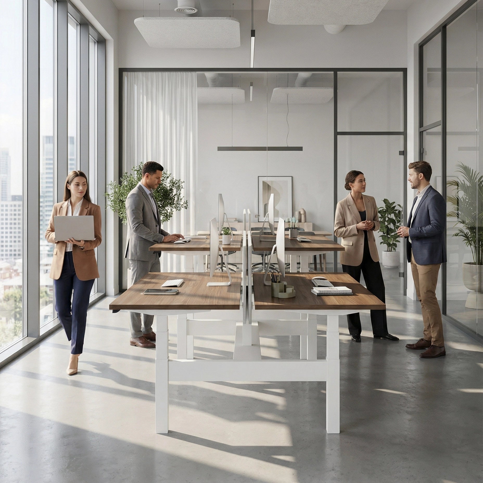 HAT Collective Height adjustable 4pod with white base and walnut Tops with people working in an open office. Kansas City Office Design