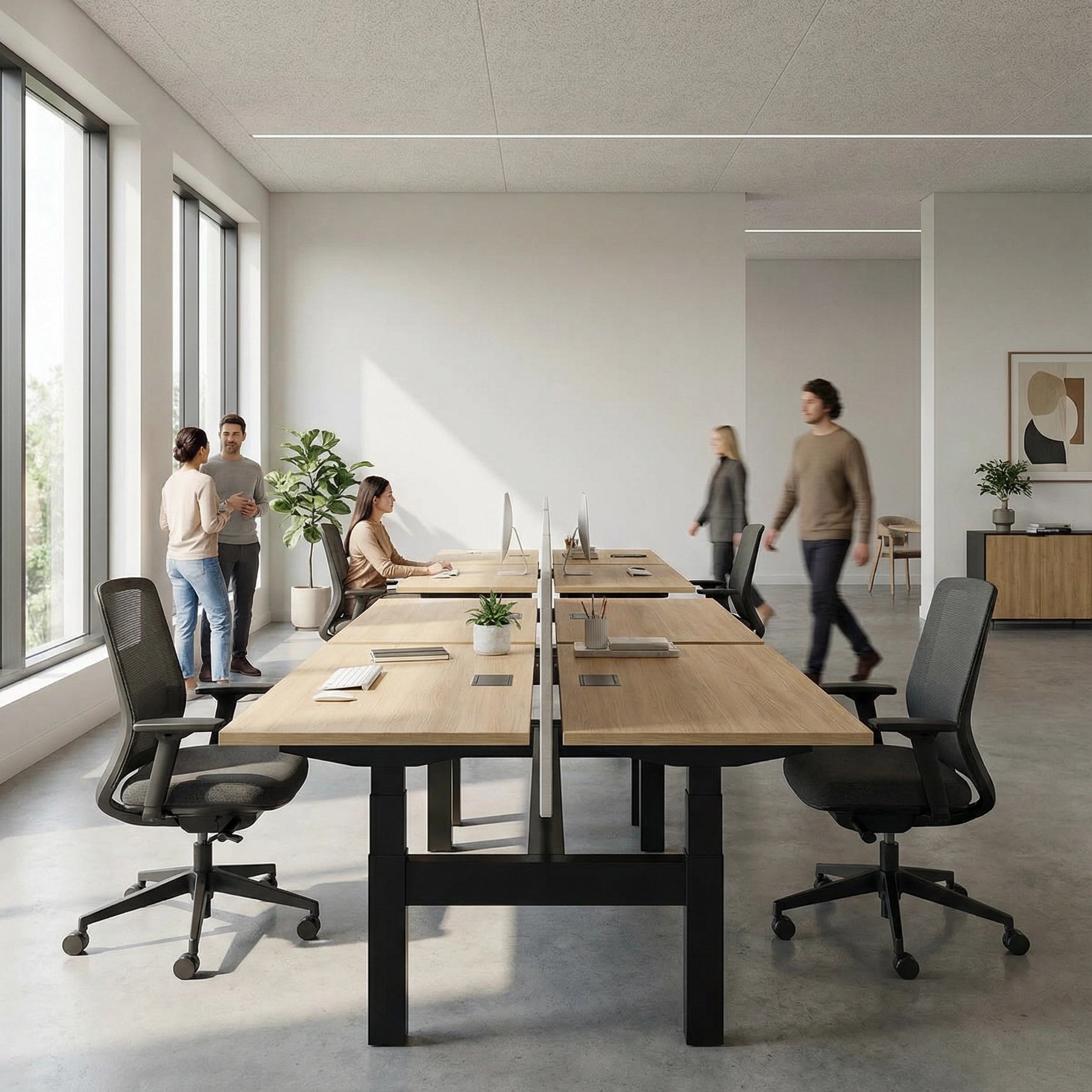 HAT Collective Height adjustable 4pod with black base and cypress fawn tops with people working in an open office. Kansas City Office Design