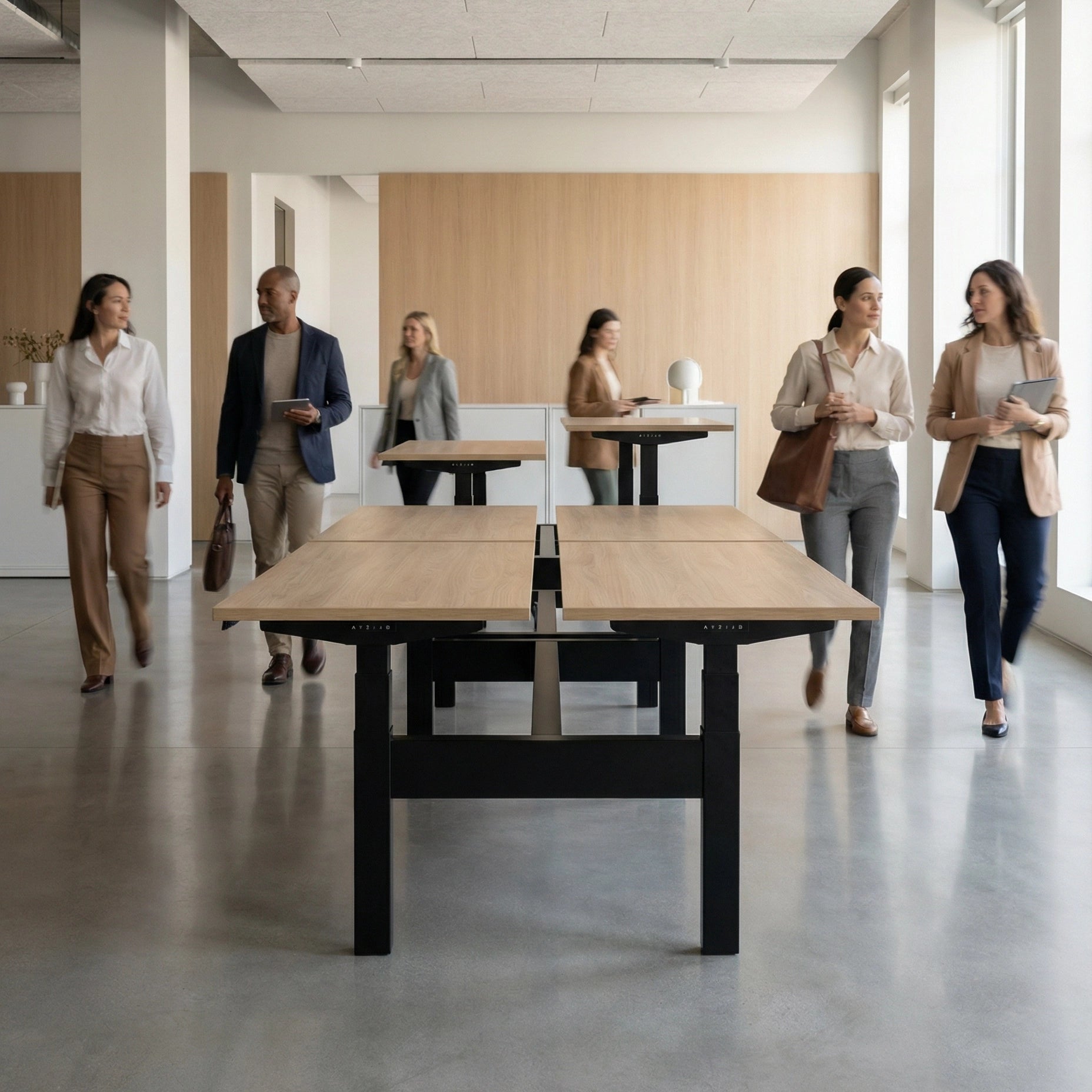 HAT Collective Height adjustable 4pod with black base and cypress fawn tops with people working in an open office. Kansas City Office Design