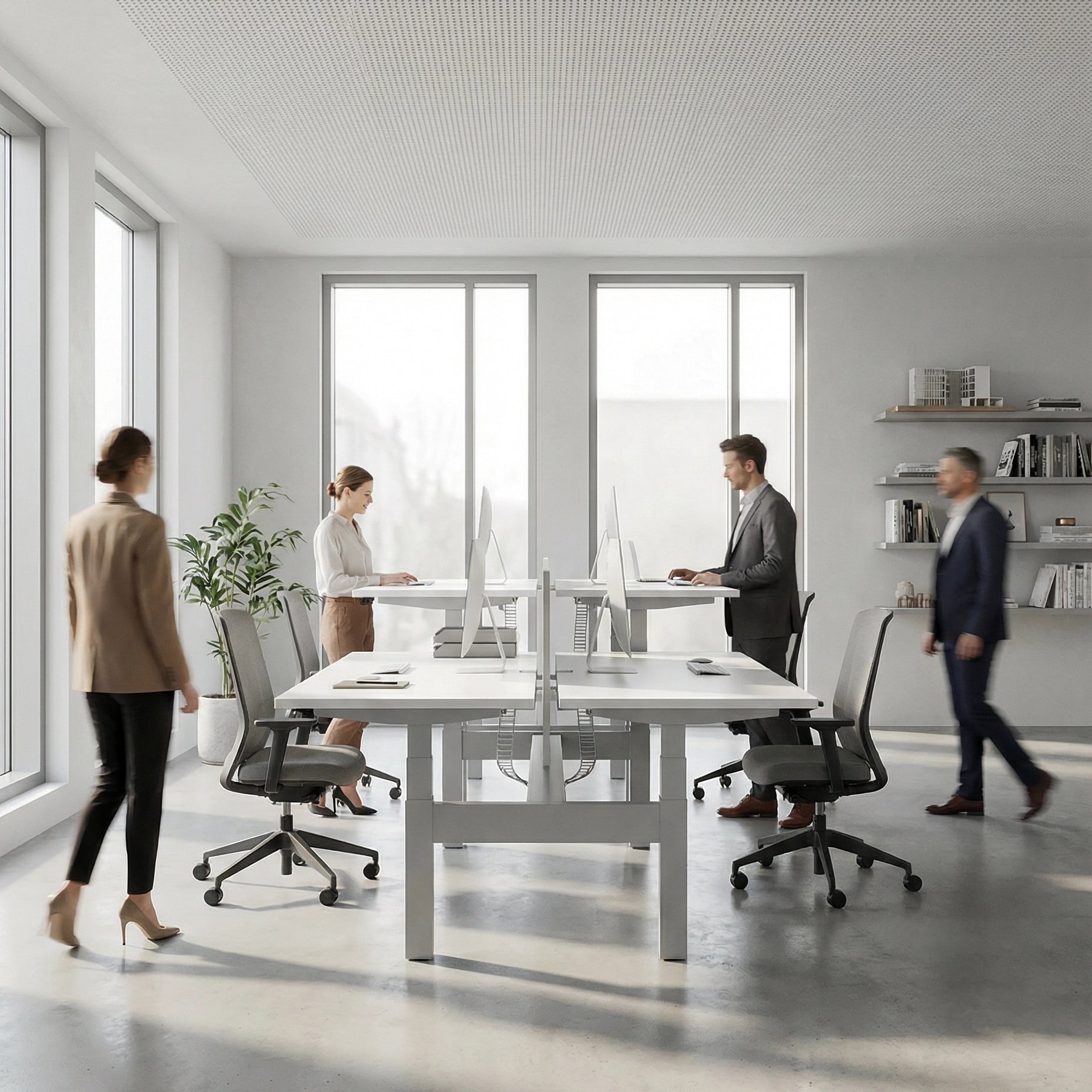 HAT Collective Height adjustable 4pod with Silver Base and Designer White Tops with people working in an open office. Kansas City Office Design