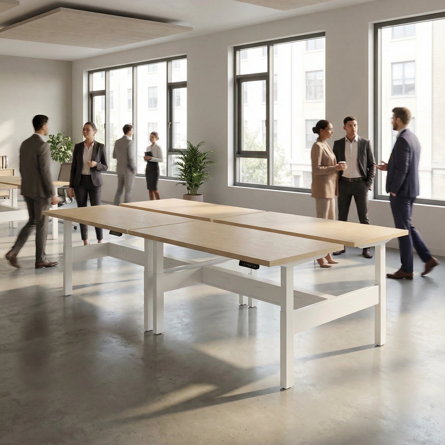 HAT Collective Height adjustable 4pod with white base and maple with people working in an open office. Kansas City Office Design