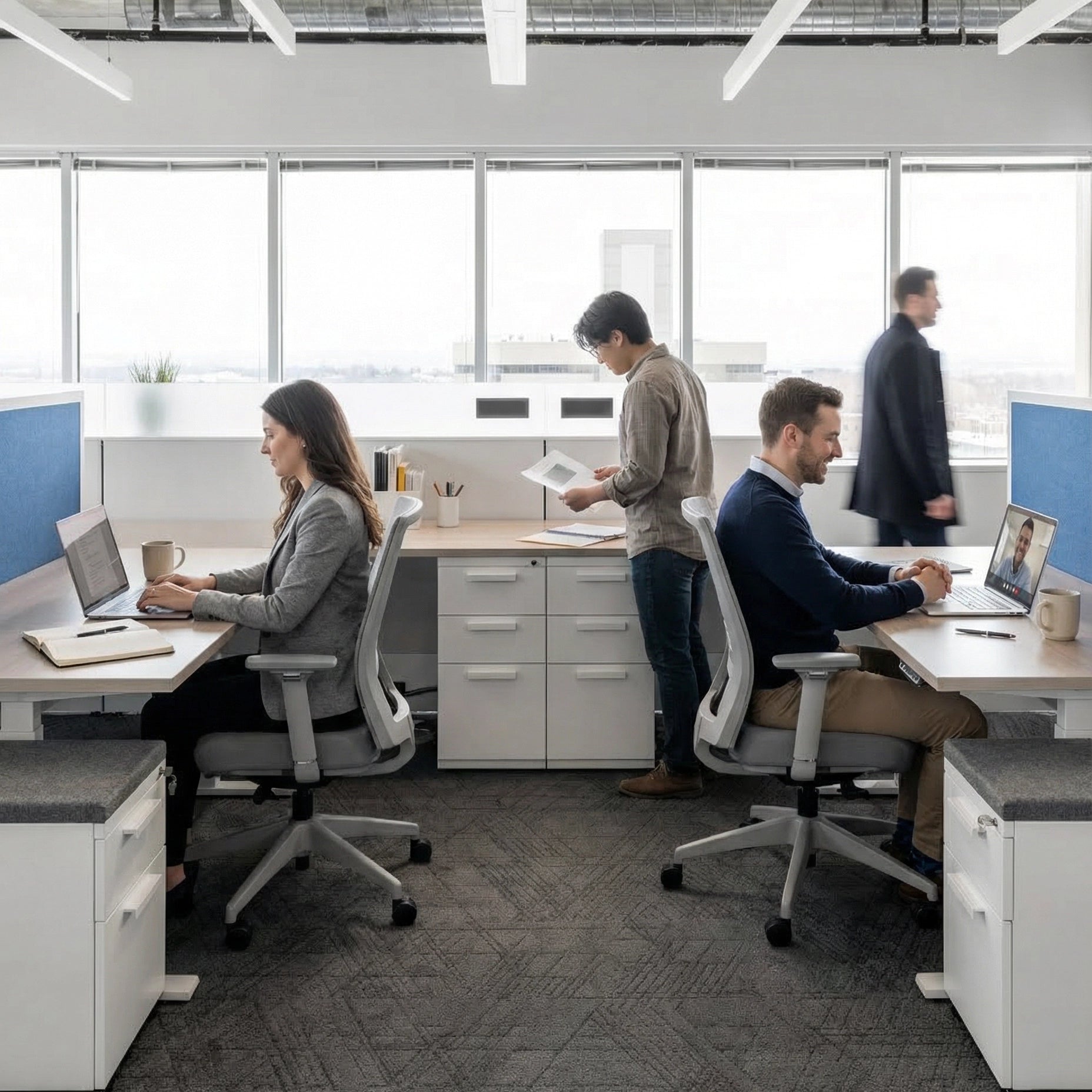 Modern office with employees working at their desks. Kansas City Office Design
