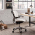 Ergonomic Humanscale Freedom office chair in a modern office setting with a desk and window. Kansas City Office Design.