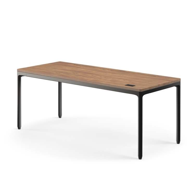 Side view of the Humanscale eFloat Quattro height adjustable 29"x70" desk with black base and walnut top. Kansas City Office Design.