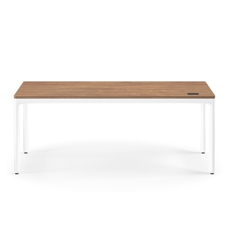 Front view of the Humanscale eFloat Quattro height adjustable 29"x70" desk with white base and walnut top. Kansas City Office Design.