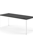 Side view of the Humanscale eFloat Quattro height adjustable 29"x70" desk with white base and black top. Kansas City Office Design.