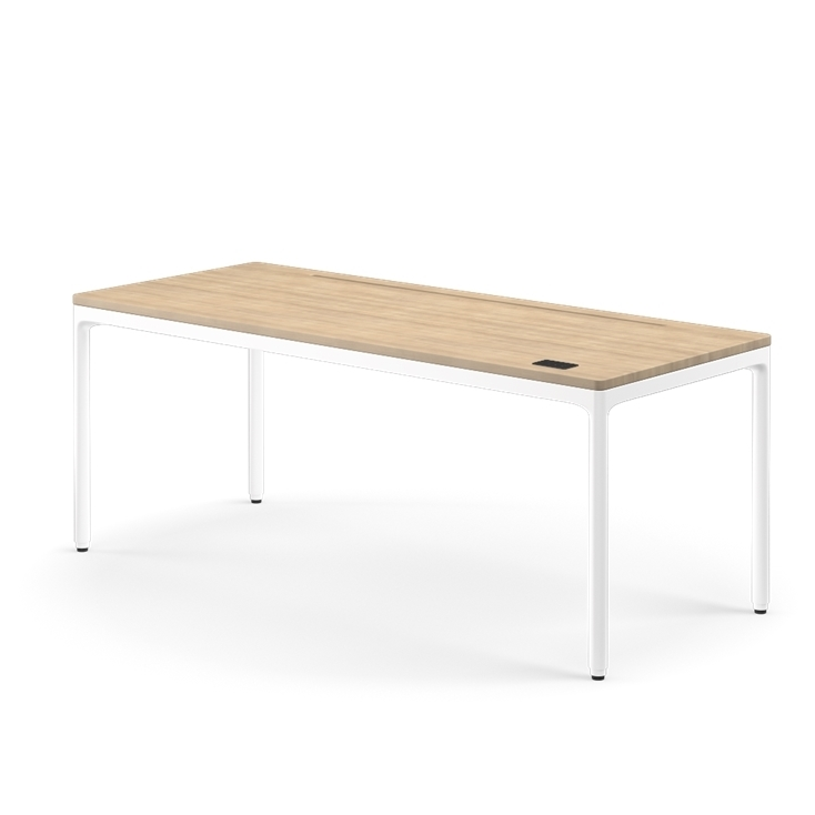 Side view of the Humanscale eFloat Quattro height adjustable 29"x70" desk with white base and white oak top. Kansas City Office Design.