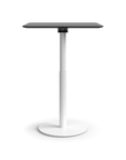 Humanscale Float Gather 30" square Table in white base with black laminate top in standing position. Kansas City Office Design.
