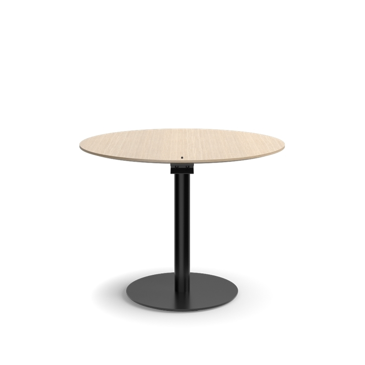 Humanscale Float Gather 36" round Table in black base with white oak veneer top in sitting position. Kansas City Office Design.