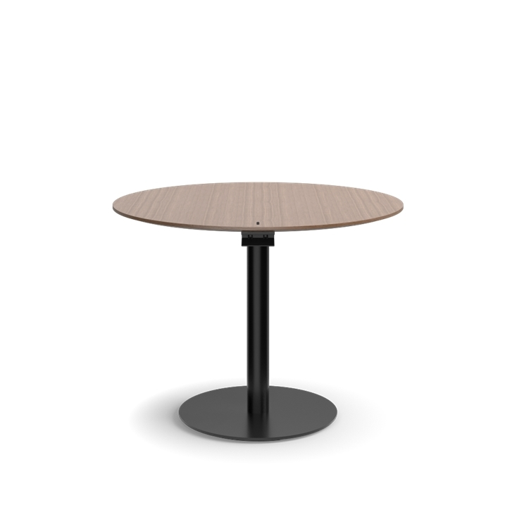 Humanscale Float Gather 36" round Table in black base with walnut veneer top in sitting position. Kansas City Office Design.