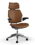 Side view of the HumanScale Freedom with Headrest in a saddle leather fabric with polished frame. Kansas City Office Furniture.
