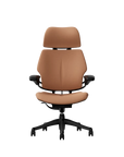 Humanscale Freedom executive chair with headrest, black frame with Elmosoft Leather 33077, front view. Kansas City Office Design.