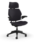 Side view of the HumanScale Freedom with Headrest in a black fabric with black frame. Kansas City Office Furniture.