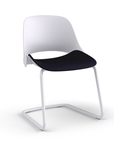 Side view of a Humanscale Trea Chair with cantilever guest chair with glides. In white finish with a black fabric padded seat. Kansas City Office Furniture. 