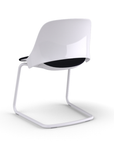 Back view of a Humanscale Trea Chair with cantilever guest chair with glides. In white finish with a black fabric padded seat. Kansas City Office Furniture. 
