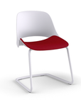 Side view of a Humanscale Trea Chair with cantilever guest chair with glides. In white finish with a Parma Red fabric padded seat. Kansas City Office Furniture. 