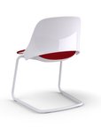 Back view of a Humanscale Trea Chair with cantilever guest chair with glides. In white finish with a Parma Red fabric padded seat. Kansas City Office Furniture. 