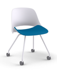 Side View of a Humanscale Trea Chair with four leg guest chair base and casters. In white finish with a peacock fabric padded seat. Kansas City Office Furniture. 