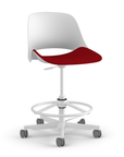 Side view of a Humanscale Trea Chair with stool base and casters. In white finish with a Parma Red fabric padded seat. Kansas City Office Furniture. 